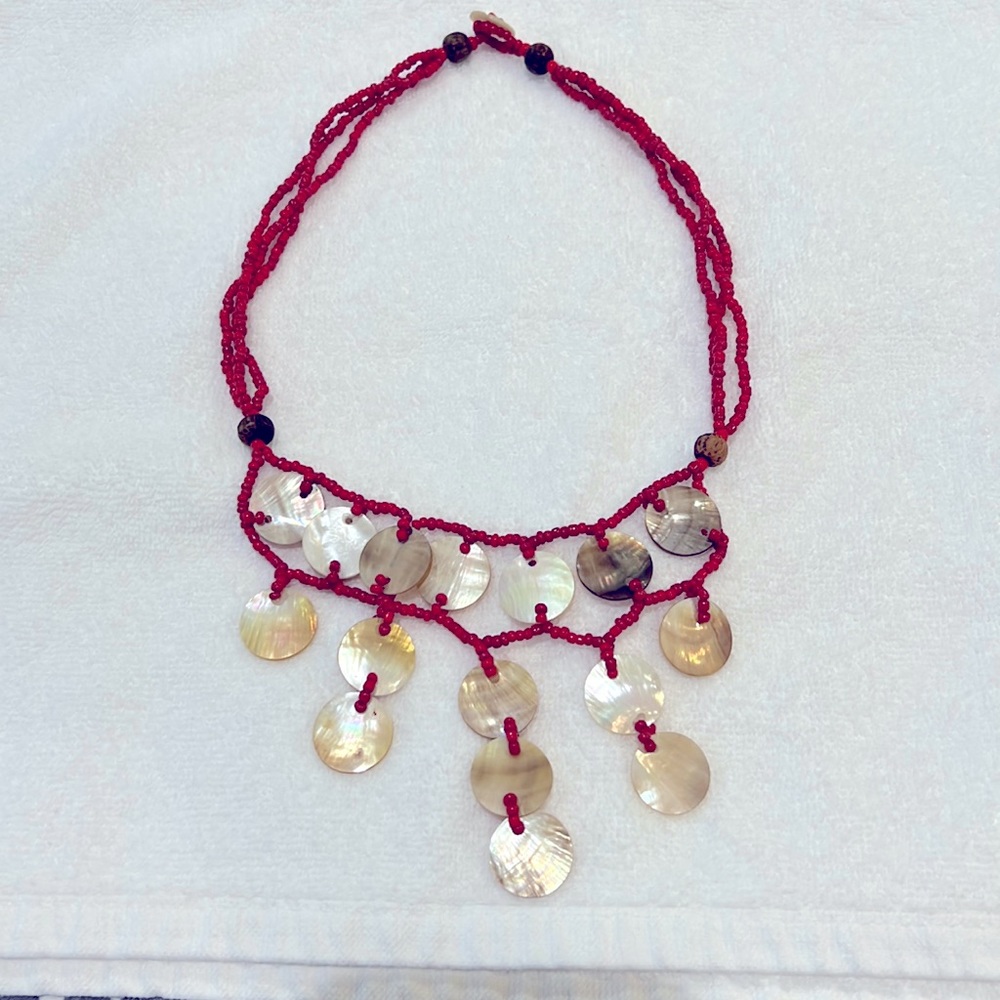 Beautiful beaded necklace with coral beads and mother of pearl shells